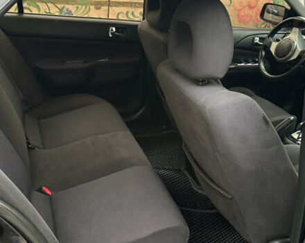 Черный Мицубиси Лансер, объемом двигателя 2 л и пробегом 143 тыс. км за 4999 $, фото 4 на Automoto.ua