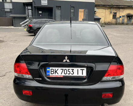 Чорний Міцубісі Lancer, об'ємом двигуна 1.58 л та пробігом 256 тис. км за 4200 $, фото 5 на Automoto.ua
