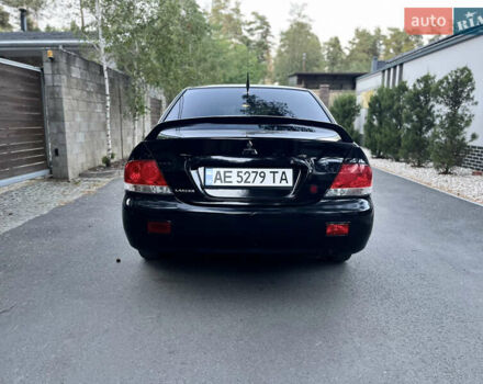 Черный Мицубиси Лансер, объемом двигателя 1.58 л и пробегом 278 тыс. км за 4800 $, фото 6 на Automoto.ua