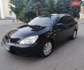 Черный Мицубиси Лансер, объемом двигателя 1.58 л и пробегом 199 тыс. км за 5500 $, фото 1 на Automoto.ua