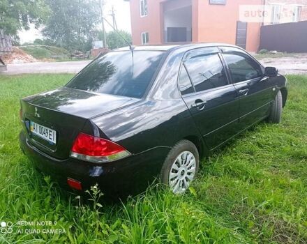 Чорний Міцубісі Lancer, об'ємом двигуна 1.58 л та пробігом 400 тис. км за 3700 $, фото 30 на Automoto.ua