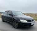Чорний Міцубісі Lancer, об'ємом двигуна 1.6 л та пробігом 212 тис. км за 4700 $, фото 1 на Automoto.ua