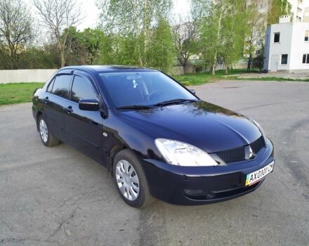 Черный Мицубиси Лансер, объемом двигателя 1.6 л и пробегом 32 тыс. км за 9000 $, фото 7 на Automoto.ua