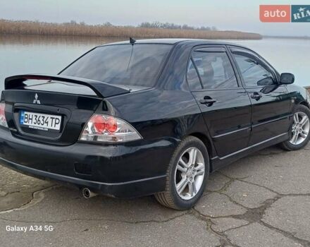 Черный Мицубиси Лансер, объемом двигателя 2 л и пробегом 286 тыс. км за 4000 $, фото 6 на Automoto.ua