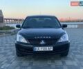 Чорний Міцубісі Lancer, об'ємом двигуна 1.58 л та пробігом 237 тис. км за 4300 $, фото 5 на Automoto.ua