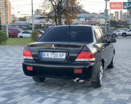 Чорний Міцубісі Lancer, об'ємом двигуна 1.58 л та пробігом 237 тис. км за 4300 $, фото 4 на Automoto.ua