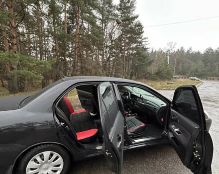 Черный Мицубиси Лансер, объемом двигателя 1.58 л и пробегом 254 тыс. км за 5000 $, фото 17 на Automoto.ua