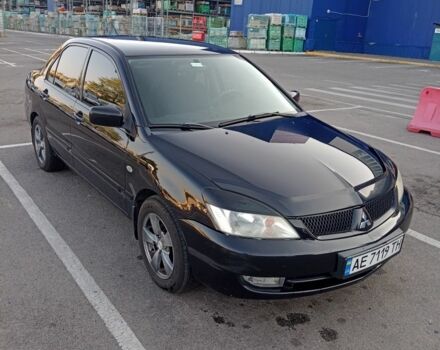 Черный Мицубиси Лансер, объемом двигателя 1.6 л и пробегом 301 тыс. км за 4300 $, фото 1 на Automoto.ua