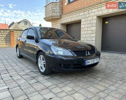 Черный Мицубиси Лансер, объемом двигателя 2 л и пробегом 272 тыс. км за 5514 $, фото 4 на Automoto.ua