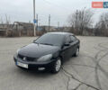 Чорний Міцубісі Lancer, об'ємом двигуна 1.58 л та пробігом 173 тис. км за 5099 $, фото 1 на Automoto.ua