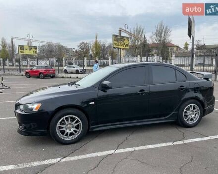 Черный Мицубиси Лансер, объемом двигателя 2 л и пробегом 246 тыс. км за 7500 $, фото 1 на Automoto.ua