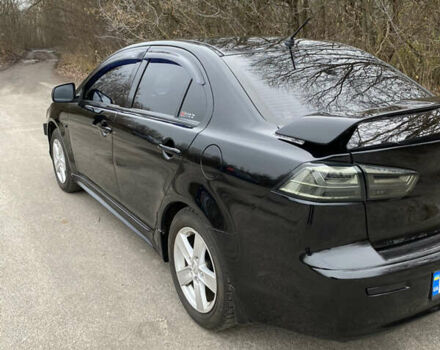 Черный Мицубиси Лансер, объемом двигателя 2 л и пробегом 164 тыс. км за 8300 $, фото 10 на Automoto.ua