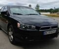 Чорний Міцубісі Lancer, об'ємом двигуна 2 л та пробігом 242 тис. км за 5500 $, фото 1 на Automoto.ua