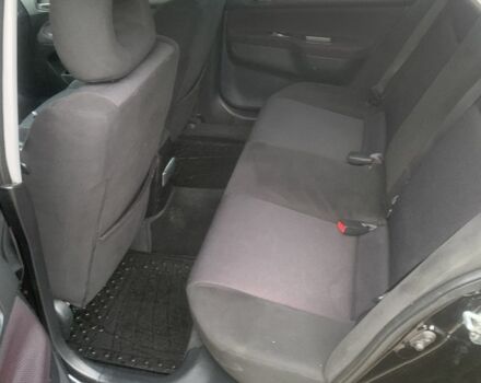 Черный Мицубиси Лансер, объемом двигателя 2 л и пробегом 240 тыс. км за 5600 $, фото 6 на Automoto.ua