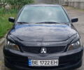 Чорний Міцубісі Lancer, об'ємом двигуна 2 л та пробігом 260 тис. км за 6500 $, фото 1 на Automoto.ua