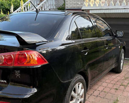 Черный Мицубиси Лансер, объемом двигателя 1.5 л и пробегом 111 тыс. км за 7500 $, фото 5 на Automoto.ua