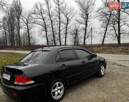 Черный Мицубиси Лансер, объемом двигателя 1.6 л и пробегом 272 тыс. км за 2800 $, фото 3 на Automoto.ua