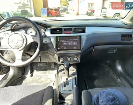 Черный Мицубиси Лансер, объемом двигателя 2 л и пробегом 272 тыс. км за 5514 $, фото 10 на Automoto.ua