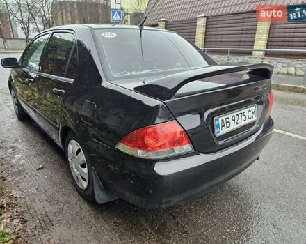 Черный Мицубиси Лансер, объемом двигателя 1.6 л и пробегом 152 тыс. км за 4999 $, фото 7 на Automoto.ua