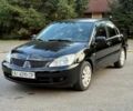 Чорний Міцубісі Lancer, об'ємом двигуна 1.6 л та пробігом 290 тис. км за 3808 $, фото 1 на Automoto.ua