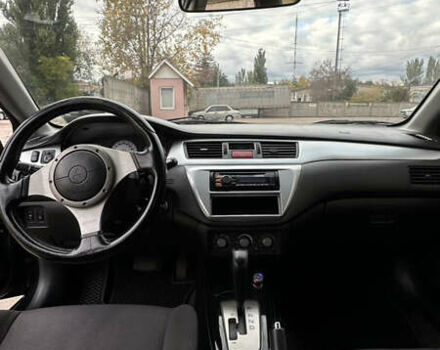 Черный Мицубиси Лансер, объемом двигателя 2 л и пробегом 143 тыс. км за 4999 $, фото 8 на Automoto.ua