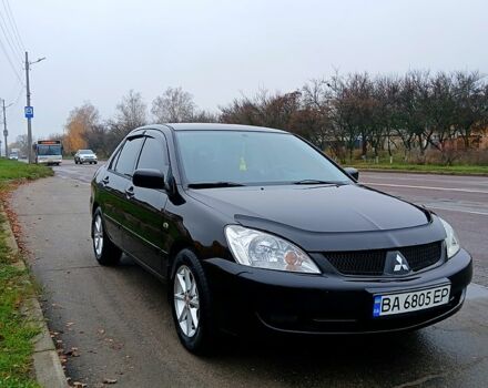 Чорний Міцубісі Lancer, об'ємом двигуна 1.6 л та пробігом 240 тис. км за 4700 $, фото 1 на Automoto.ua