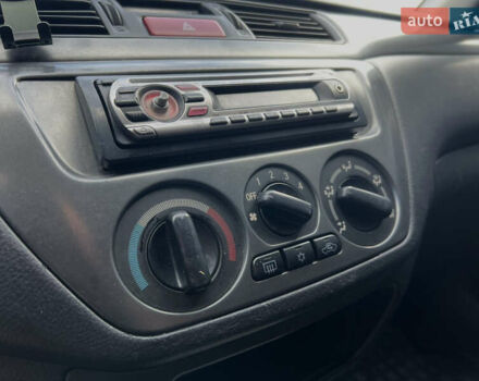 Чорний Міцубісі Lancer, об'ємом двигуна 1.58 л та пробігом 185 тис. км за 3750 $, фото 19 на Automoto.ua