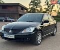 Чорний Міцубісі Lancer, об'ємом двигуна 1.58 л та пробігом 260 тис. км за 4300 $, фото 1 на Automoto.ua