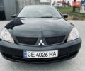 Чорний Міцубісі Lancer, об'ємом двигуна 1.6 л та пробігом 243 тис. км за 4950 $, фото 16 на Automoto.ua