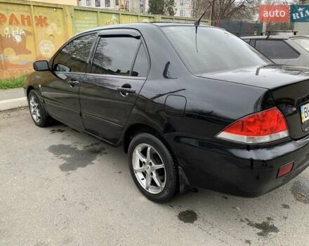 Черный Мицубиси Лансер, объемом двигателя 1.6 л и пробегом 164 тыс. км за 5200 $, фото 2 на Automoto.ua