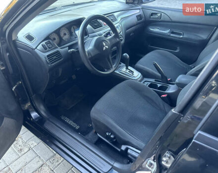 Черный Мицубиси Лансер, объемом двигателя 1.59 л и пробегом 269 тыс. км за 4999 $, фото 11 на Automoto.ua