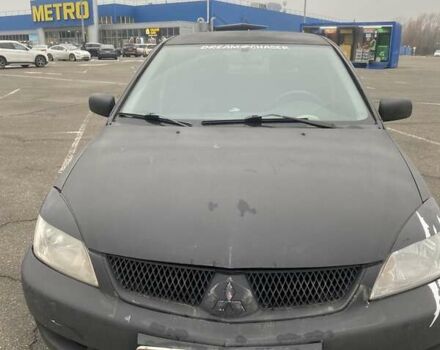 Черный Мицубиси Лансер, объемом двигателя 1.58 л и пробегом 263 тыс. км за 4000 $, фото 6 на Automoto.ua