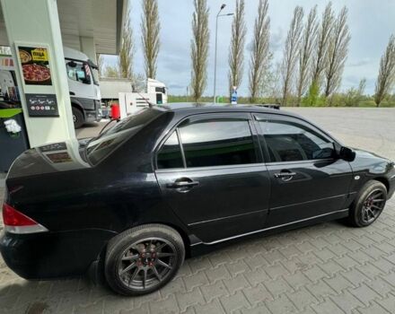 Черный Мицубиси Лансер, объемом двигателя 1.6 л и пробегом 211 тыс. км за 5600 $, фото 7 на Automoto.ua