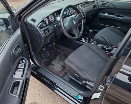 Чорний Міцубісі Lancer, об'ємом двигуна 1.6 л та пробігом 273 тис. км за 3999 $, фото 28 на Automoto.ua