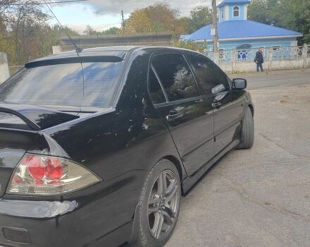 Міцубісі Lancer 2007 у Кам'янське (Дніпродзержинськ) на Automoto.ua Чорний Міцубісі Lancer, об'ємом двигуна 2 л та пробігом 268 тис. км за 5999 $, фото 4 на Automoto.ua