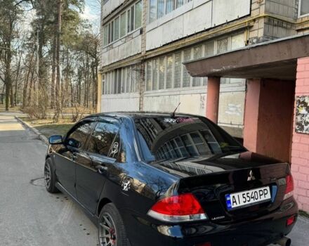 Черный Мицубиси Лансер, объемом двигателя 1.6 л и пробегом 211 тыс. км за 5600 $, фото 1 на Automoto.ua