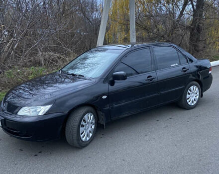 Черный Мицубиси Лансер, объемом двигателя 1.58 л и пробегом 213 тыс. км за 4900 $, фото 1 на Automoto.ua