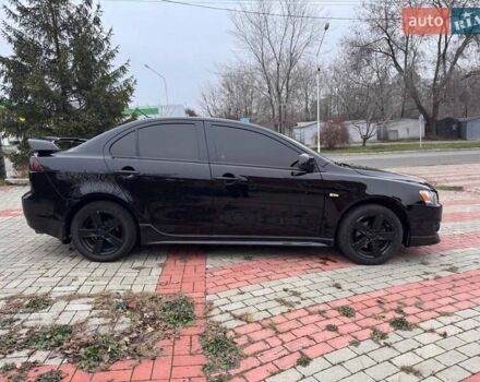 Черный Мицубиси Лансер, объемом двигателя 2 л и пробегом 217 тыс. км за 5500 $, фото 3 на Automoto.ua