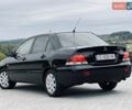 Черный Мицубиси Лансер, объемом двигателя 1.58 л и пробегом 243 тыс. км за 4950 $, фото 7 на Automoto.ua