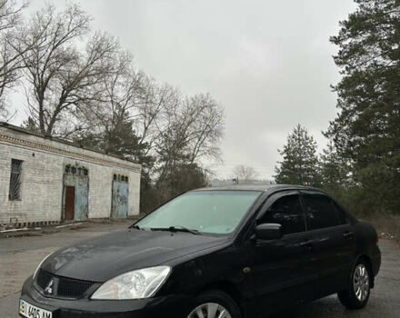 Черный Мицубиси Лансер, объемом двигателя 1.58 л и пробегом 254 тыс. км за 5000 $, фото 1 на Automoto.ua