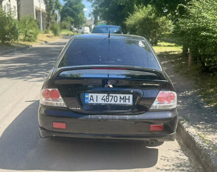 Чорний Міцубісі Lancer, об'ємом двигуна 2 л та пробігом 210 тис. км за 5500 $, фото 47 на Automoto.ua