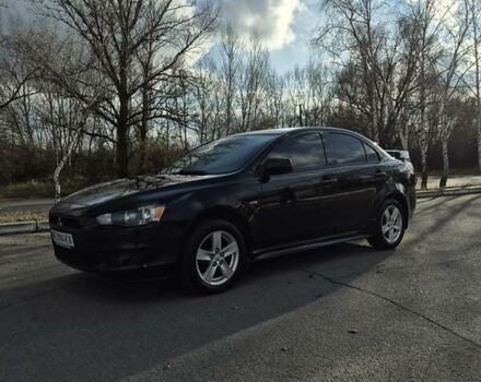 Черный Мицубиси Лансер, объемом двигателя 2 л и пробегом 224 тыс. км за 7000 $, фото 1 на Automoto.ua