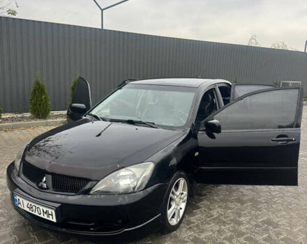 Чорний Міцубісі Lancer, об'ємом двигуна 2 л та пробігом 210 тис. км за 5500 $, фото 13 на Automoto.ua