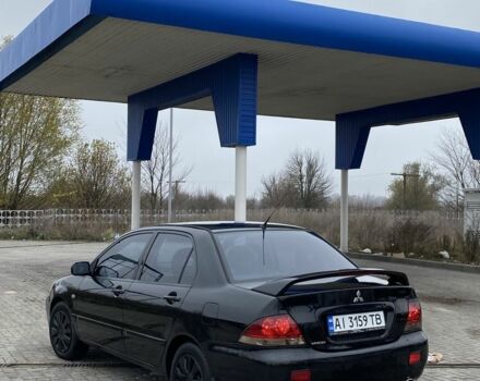 Черный Мицубиси Лансер, объемом двигателя 1.6 л и пробегом 263 тыс. км за 2900 $, фото 3 на Automoto.ua