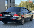 Чорний Міцубісі Lancer, об'ємом двигуна 1.58 л та пробігом 191 тис. км за 4899 $, фото 7 на Automoto.ua