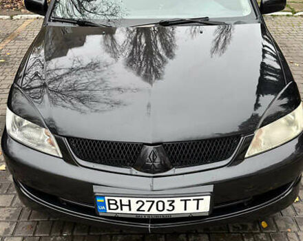 Чорний Міцубісі Lancer, об'ємом двигуна 1.59 л та пробігом 300 тис. км за 3400 $, фото 1 на Automoto.ua