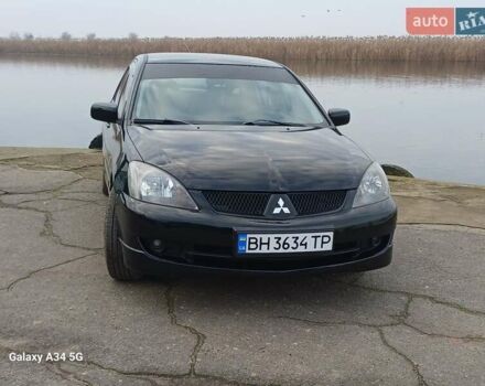 Черный Мицубиси Лансер, объемом двигателя 2 л и пробегом 286 тыс. км за 4000 $, фото 9 на Automoto.ua