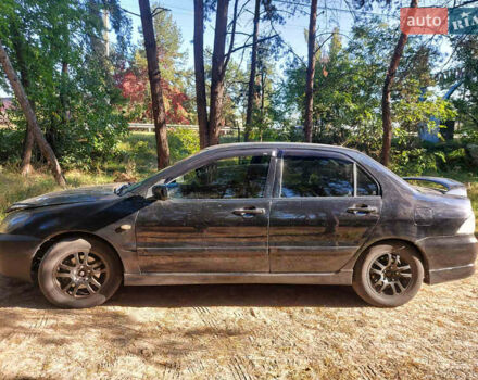 Чорний Міцубісі Lancer, об'ємом двигуна 2 л та пробігом 290 тис. км за 3300 $, фото 6 на Automoto.ua