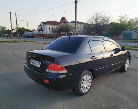 Черный Мицубиси Лансер, объемом двигателя 1.6 л и пробегом 32 тыс. км за 9000 $, фото 15 на Automoto.ua