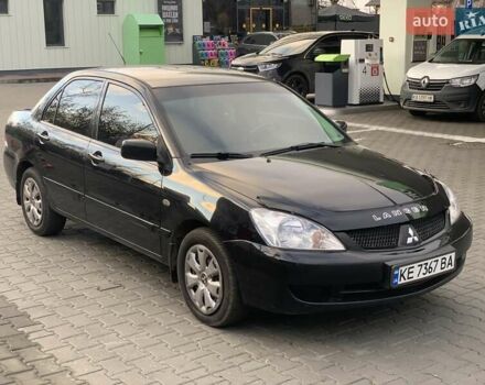 Черный Мицубиси Лансер, объемом двигателя 1.58 л и пробегом 237 тыс. км за 3850 $, фото 1 на Automoto.ua